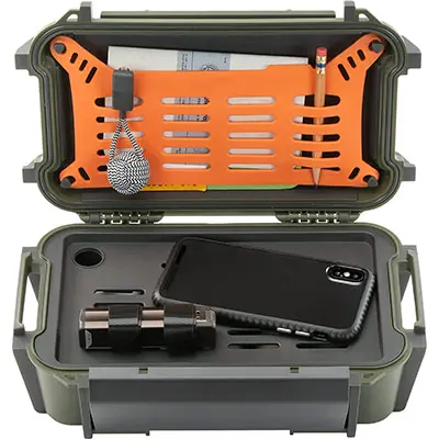 a green pelican r60 ruck case, open and containing a phone, penical, paper, and small tools