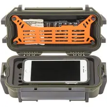 a green Pelican r20 ruck case, open and containing a phone, money, and small granola bar