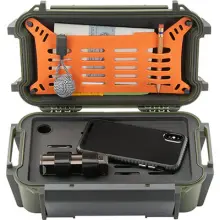 a green pelican r60 ruck case, open and containing a phone, penical, paper, and small tools
